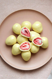 A model wearing the 100G White Chocolate Freeze Dried Strawberries in colour Strawberry (White), from the front, showing the whole outfit