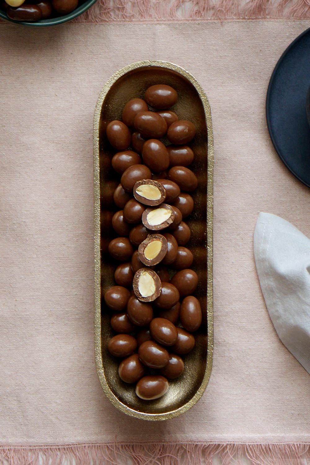 Product shot of the 150g Milk Chocolate Almonds - Milkalmonds in colour Milkalmonds, showing detail