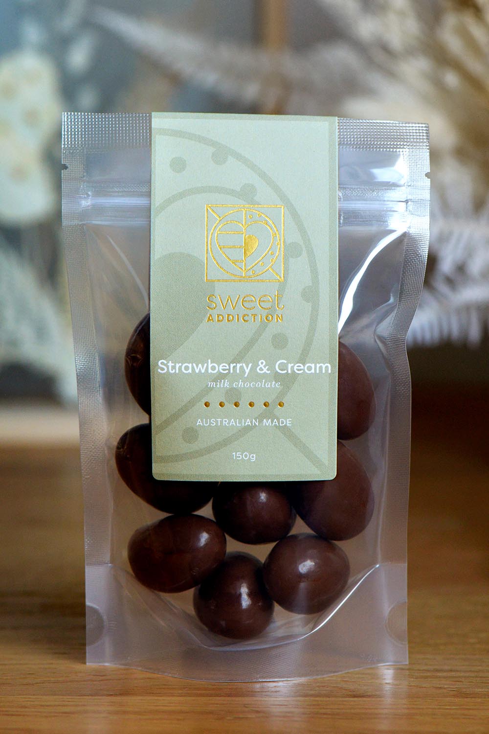 A model wearing the 150G Milk Chocolate Strawberry And Cream in colour Strcremilk, from the front, showing the whole outfit