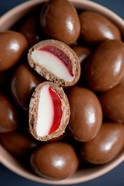 A model wearing the 150G Milk Chocolate Strawberry And Cream in colour Strcremilk, from the front, showing the whole outfit