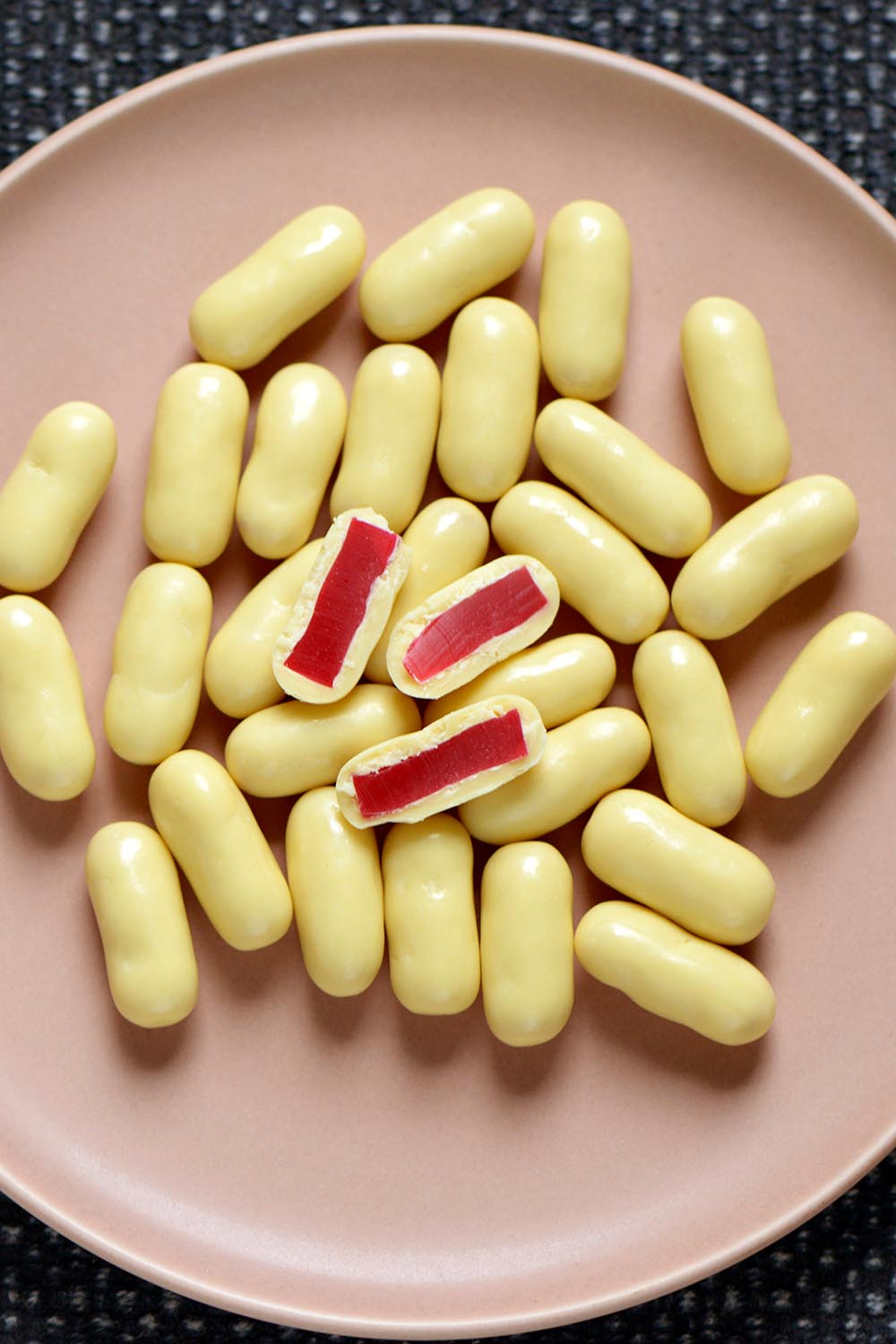 A model wearing the 150G White Chocolate Raspberry Bullets in colour Whiterasp (White), from the front, showing the whole outfit