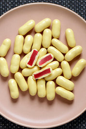 A model wearing the 150G White Chocolate Raspberry Bullets in colour Whiterasp (White), from the front, showing the whole outfit