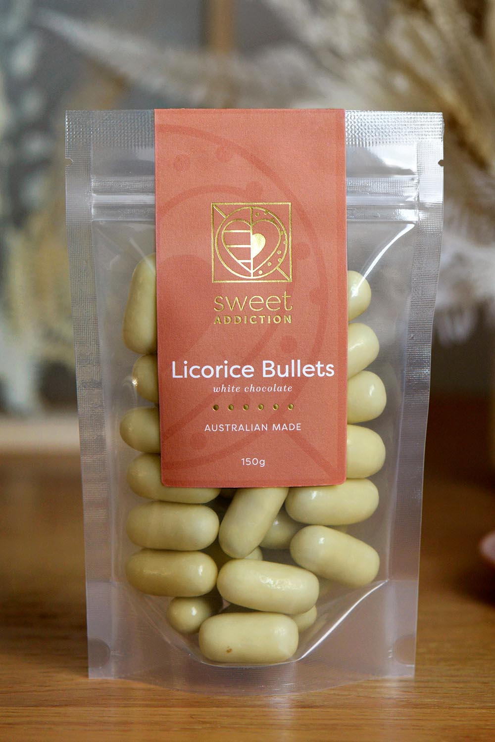 A model wearing the 150G White Chocolate Raspberry Bullets in colour Whiterasp (White), from the front, showing the whole outfit