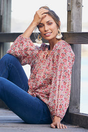 Model Amanda wearing the Aquarius Top in colour Poppyfield (Pink), from the front, showing the whole outfit
