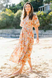 Model Alex wearing size S of the Halo 3/4 Sleeve Dress in colour Secrgard (Blue), from the front, showing the whole outfit