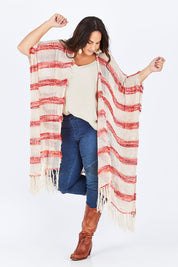 Model Stacey wearing size OneSize of the Morocco Poncho in colour Hirani, from the front, showing the whole outfit
