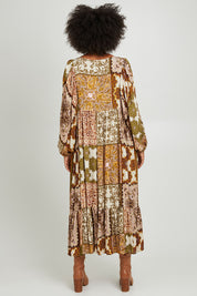 Model Olivia wearing the Mira Dress in colour Paisleygar, from the back