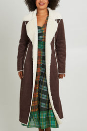 Model Olivia wearing size S of the Sterling Coat in colour Chocolate, from the front, cropped image