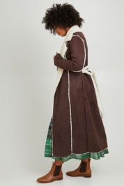 Model Olivia wearing size S of the Sterling Coat in colour Chocolate, from the front, showing the whole outfit