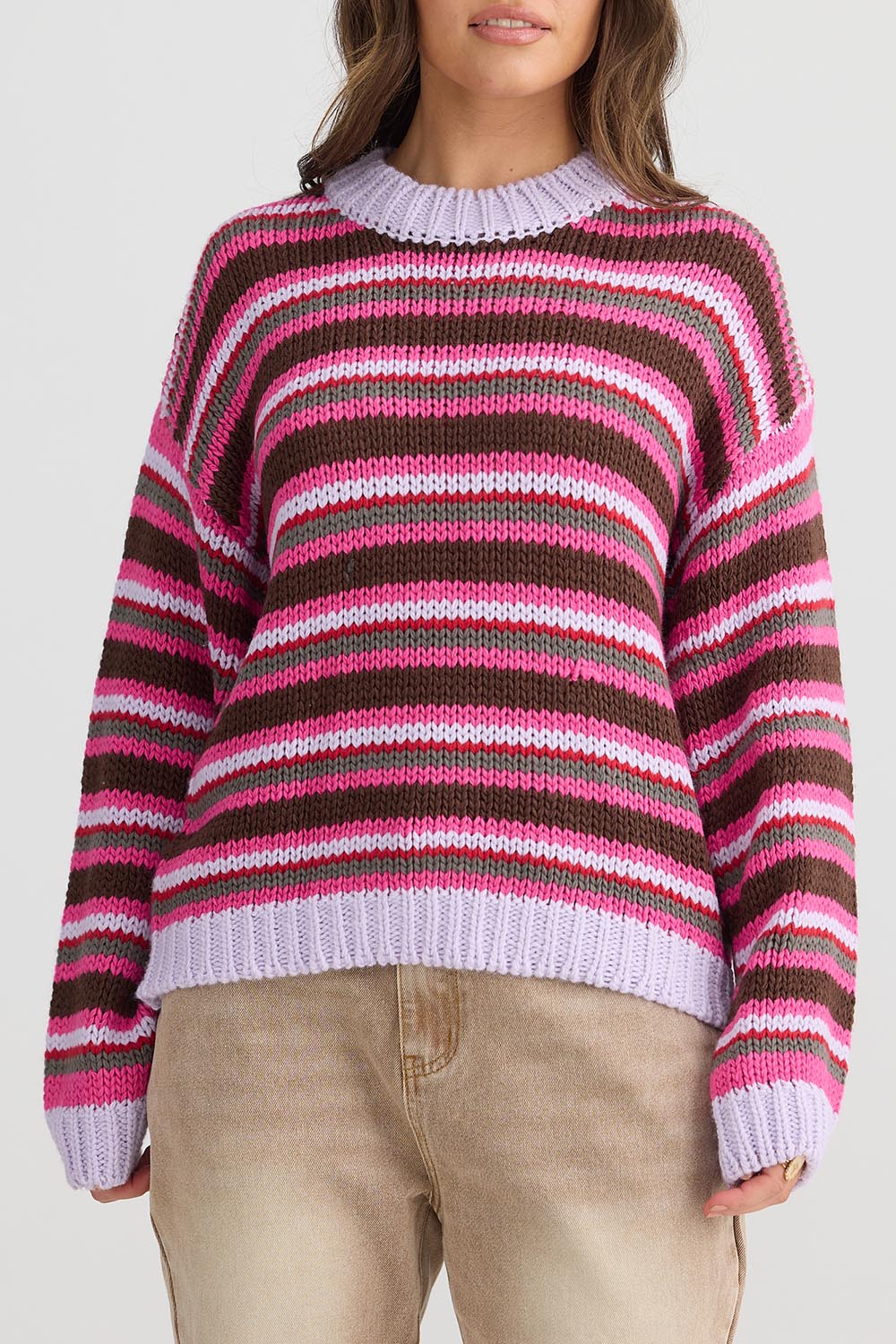 A model wearing the All Sorts Knit in colour Lilacstrip, from the front, cropped image