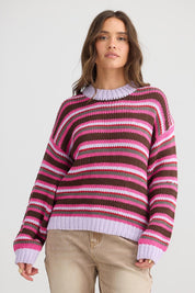 A model wearing the All Sorts Knit in colour Lilacstrip, from the front, cropped image