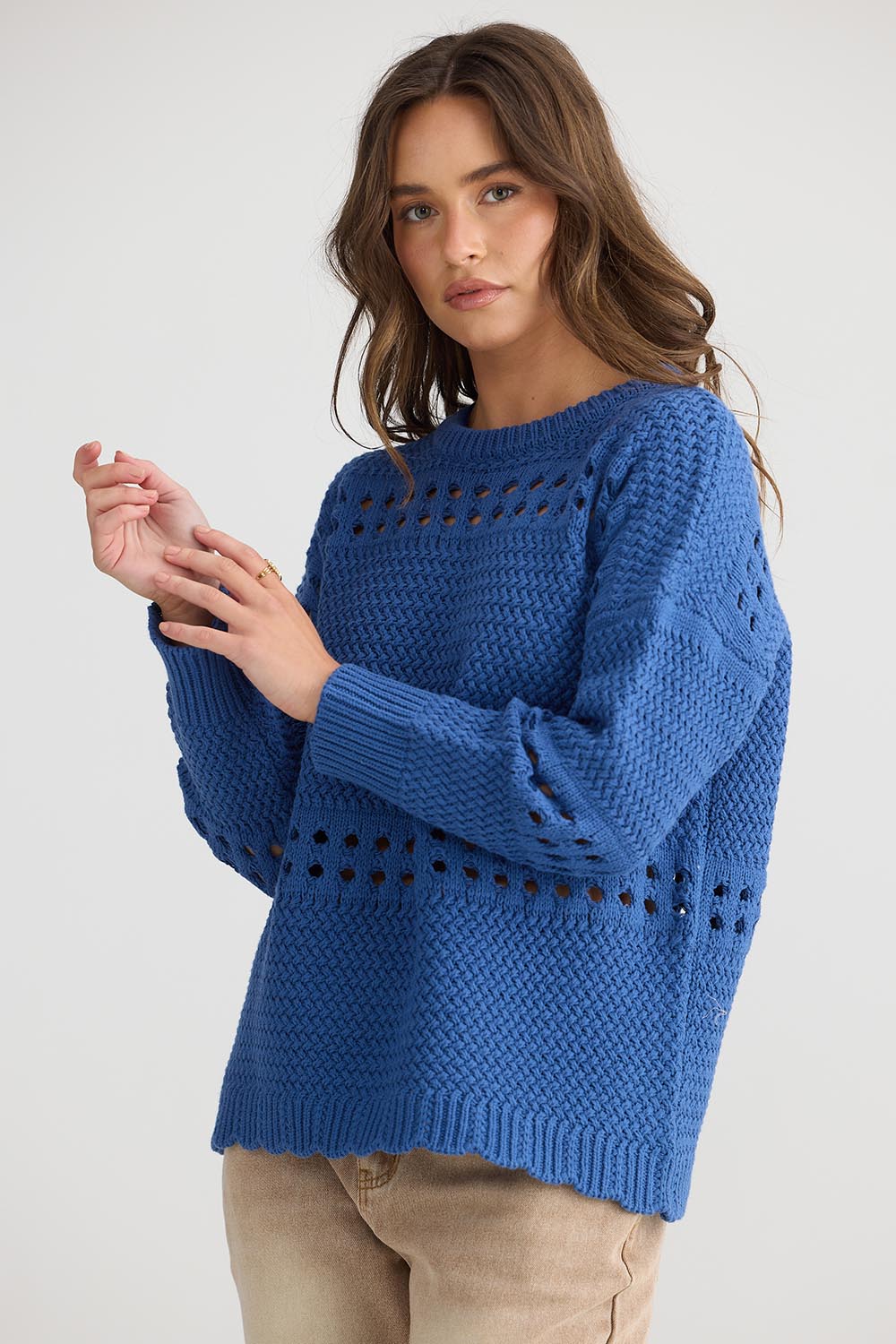 A model wearing the Tanner Cotton Blend Knit in colour Seablue (Blue), from the front, cropped image