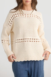 A model wearing the Tanner Cotton Blend Knit in colour Vanilla, from the front, cropped image