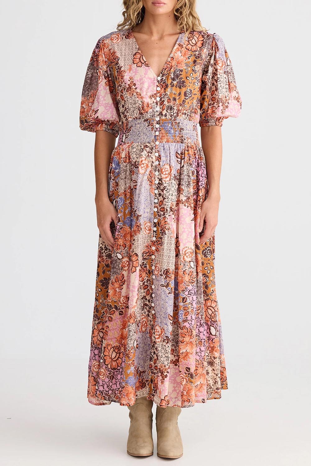 A model wearing the Halo Cotton Dress in colour Dreamweav (Pink), from the front, cropped image