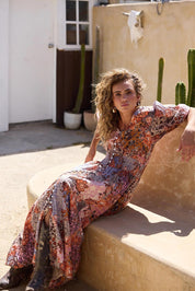 A model wearing the Halo Cotton Dress in colour Dreamweav (Pink), from the front, showing the whole outfit