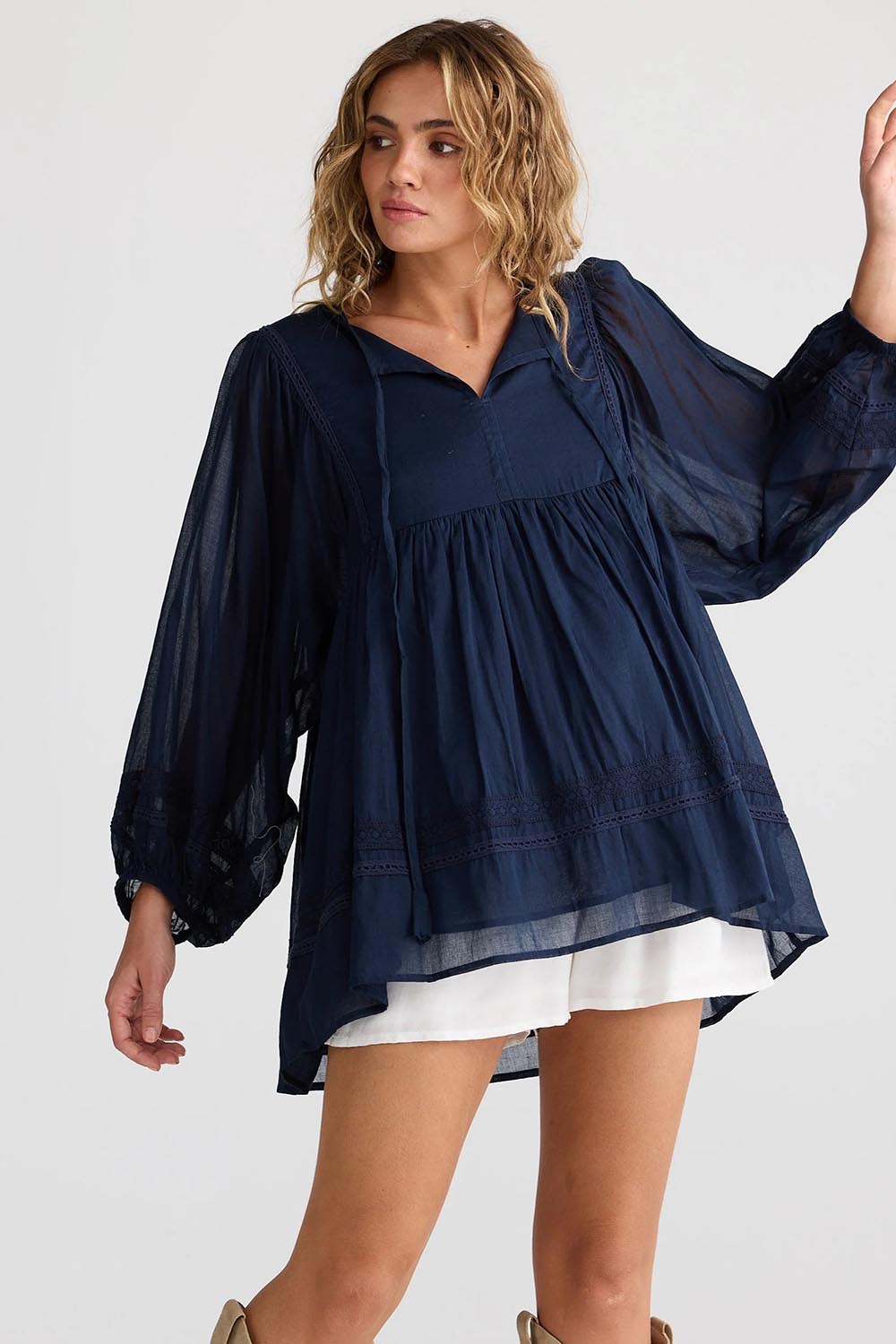 A model wearing the Solstice Cotton Blouse in colour Navy (Blue), from the front, cropped image