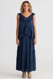 A model wearing the Exhale Cami in colour Navy (Blue), from the front, showing the whole outfit