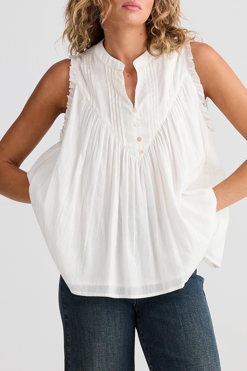 A model wearing the Sprite Cotton Sleeveless Top in colour White (White), from the front, cropped image