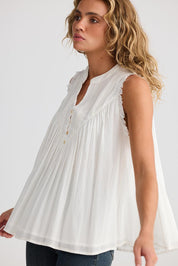 A model wearing the Sprite Cotton Sleeveless Top in colour White (White), from the front, cropped image