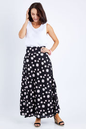 Model Andrea wearing size 10 of the Rosie Maxi Skirt in colour Daisychain (Black), from the front, showing the whole outfit