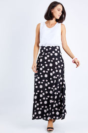 Model Andrea wearing size 10 of the Rosie Maxi Skirt in colour Daisychain (Black), from the front, showing the whole outfit