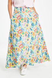 Model Laura wearing size 14 of the Rosie Maxi Skirt in colour Meadow (Blue), from the front, cropped image