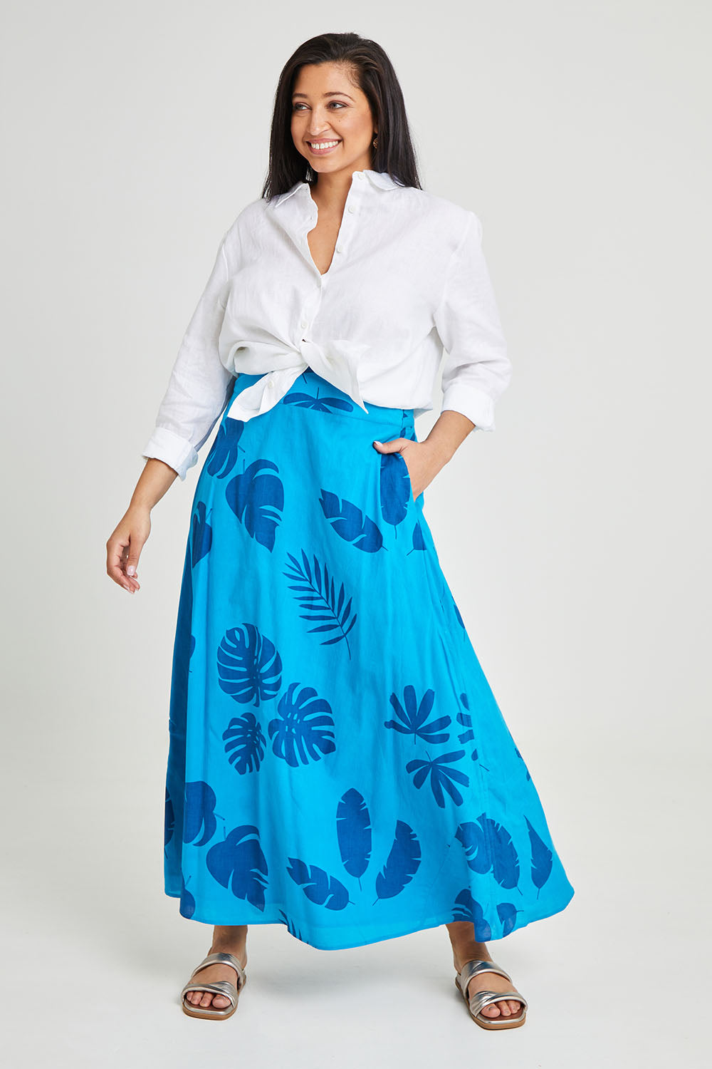 Model Terri-Leigh wearing size 14 of the Rosie Maxi Skirt in colour Palm (Blue), from the front, showing the whole outfit