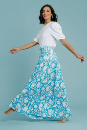 Model Natalie wearing size 10 of the Rosie Maxi Skirt in colour Gerbera (Blue), from the front, showing the whole outfit