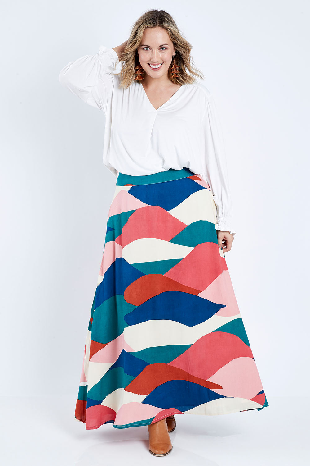 Model Jess wearing size 14 of the Rosie Maxi Skirt in colour Horizon (Pink), from the front, showing the whole outfit