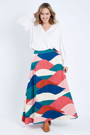 Model Jess wearing size 14 of the Rosie Maxi Skirt in colour Horizon (Pink), from the front, showing the whole outfit