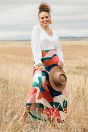 Model Lala wearing size 10 of the Rosie Maxi Skirt in colour Horizon (Pink), from the front, showing the whole outfit
