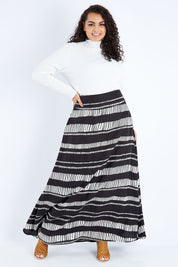 Model Sasha-Lee wearing size 16 of the Rosie Maxi Skirt in colour Sandstone (Black), from the front, showing the whole outfit