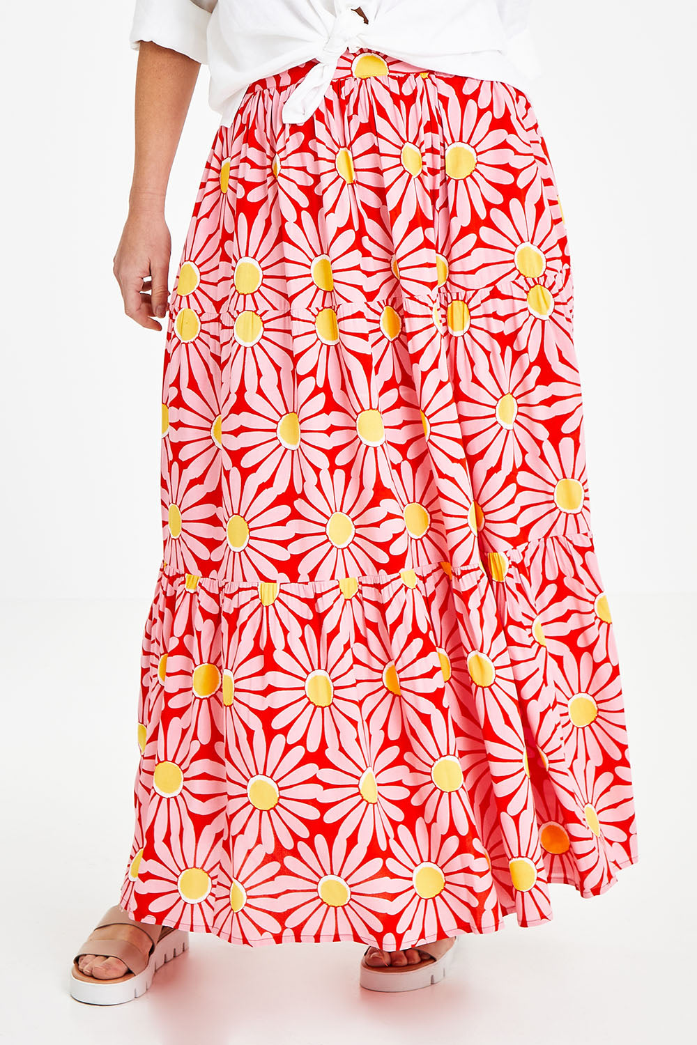 Model Laura wearing size 14 of the Mallory Tier Skirt in colour Pinkdaisy (Pink), from the front, cropped image