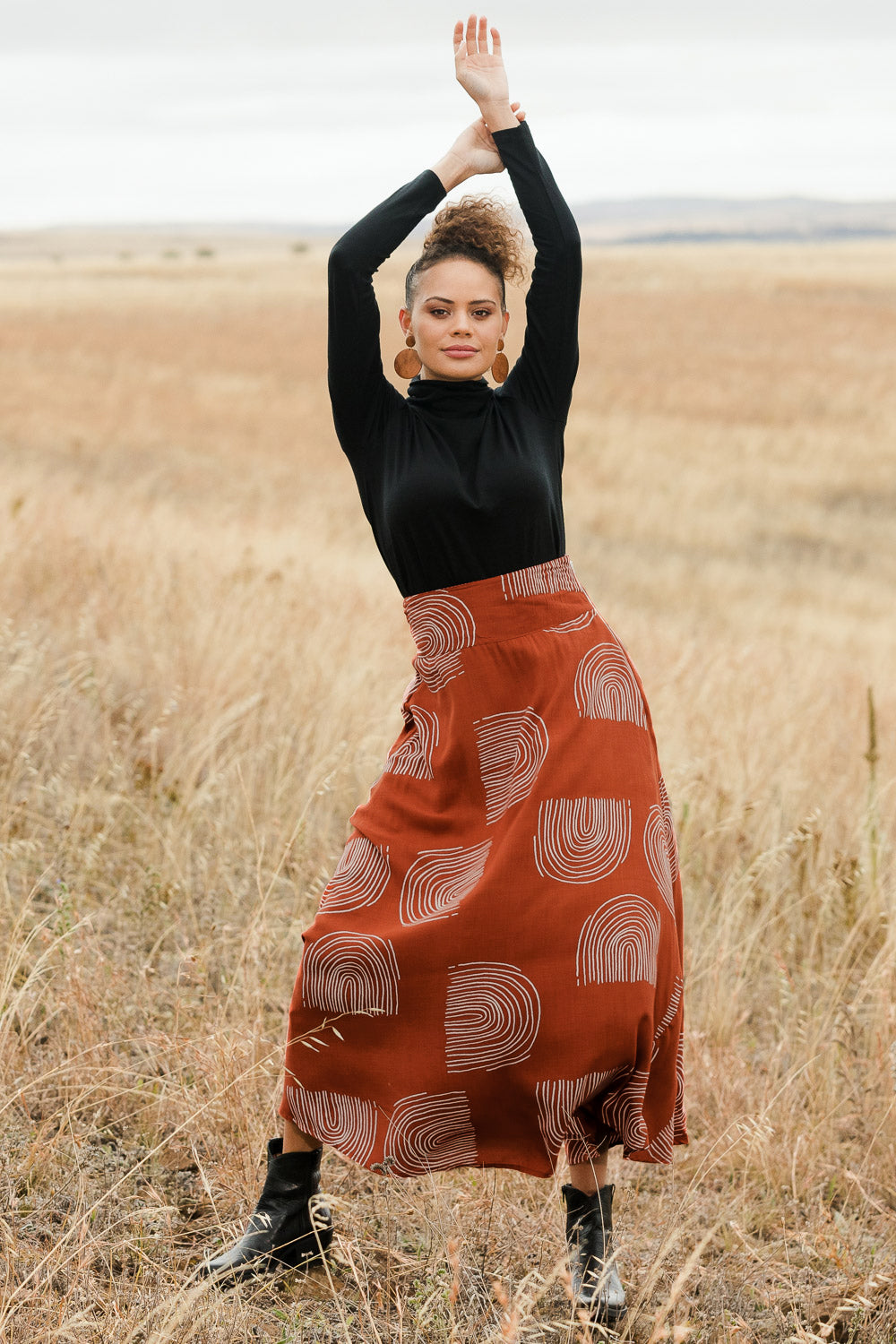Model Lala wearing size 10 of the Rose Maxi Skirt in colour Rainbow, from the front, showing the whole outfit