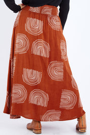 Model Sasha-Lee wearing size 16 of the Rose Maxi Skirt in colour Rainbow, from the back