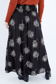 Model Sasha-Lee wearing size 16 of the Rose Maxi Skirt in colour Waratah (Black), from the back