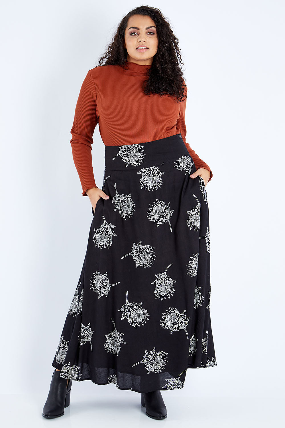 Model Sasha-Lee wearing size 16 of the Rose Maxi Skirt in colour Waratah (Black), from the front, showing the whole outfit