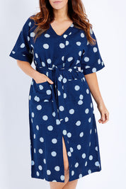 Model Laura wearing size 14 of the Madeline Kimono Dress in colour Spotme (Blue), from the front, cropped image