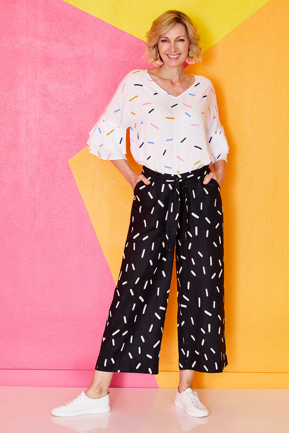 Model Veronica wearing size 10 of the Leianna 3/4 Pants in colour Sprinkles (Black), from the front, showing the whole outfit