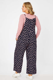 Model Jess wearing size 14 of the Tilly Overalls in colour Raindrops (Blue), from the back