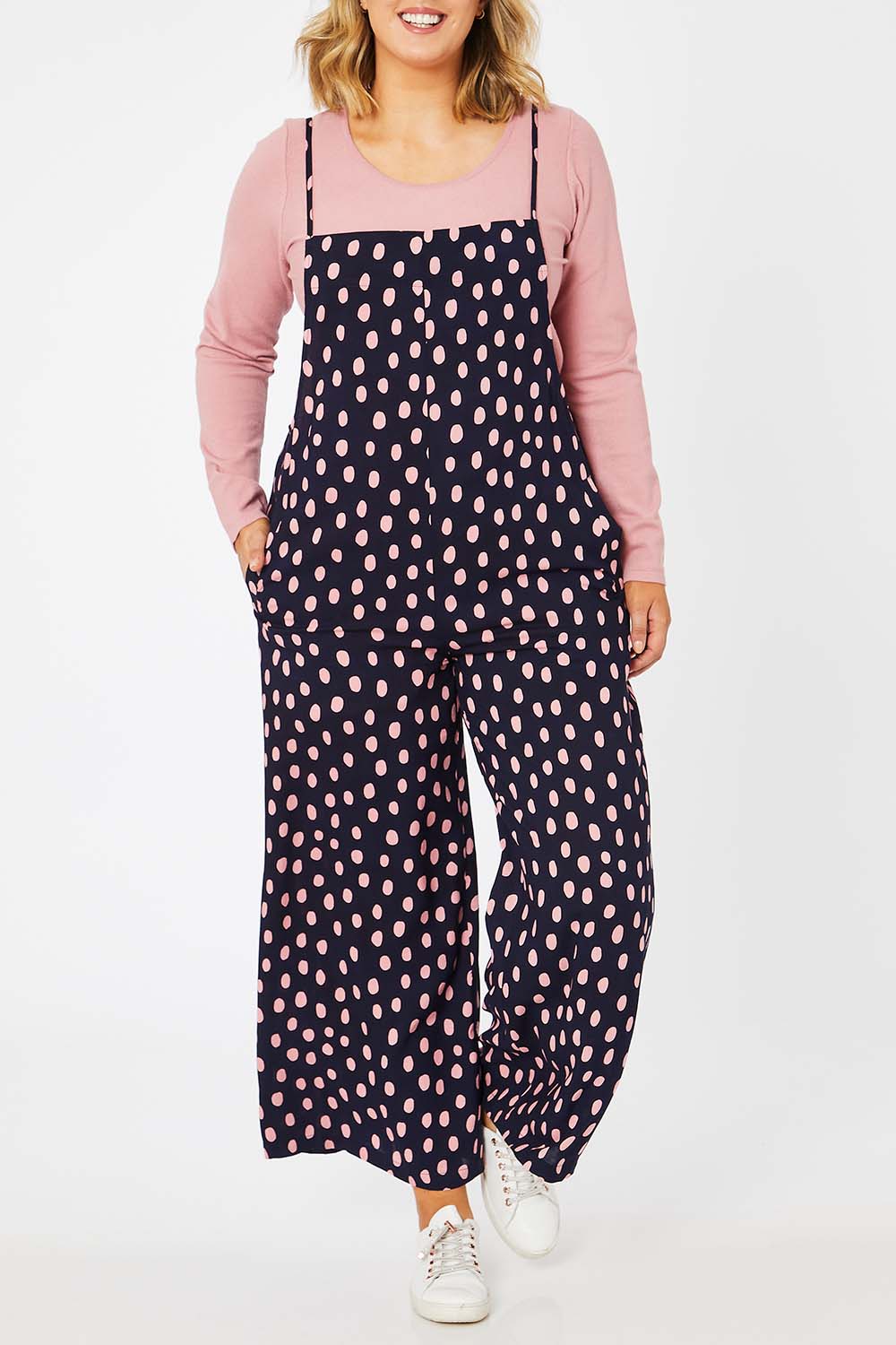 Model Jess wearing size 14 of the Tilly Overalls in colour Raindrops (Blue), from the front, cropped image