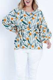Model Jess wearing size 14 of the Felicity Blouse in colour Wattle (Green), from the front, cropped image