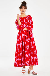 Model Courtney wearing size 10 of the Alice Gathered Dress in colour Bird (Red), from the front, showing the whole outfit