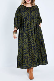 Model Jess wearing size 14 of the Alice Gathered Dress in colour Gumleaf (Black), from the front, cropped image
