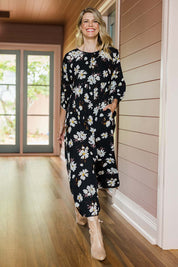 Model Kelly wearing size 10 of the Alice Gathered Dress in colour Magnolia (Black), from the front, showing the whole outfit