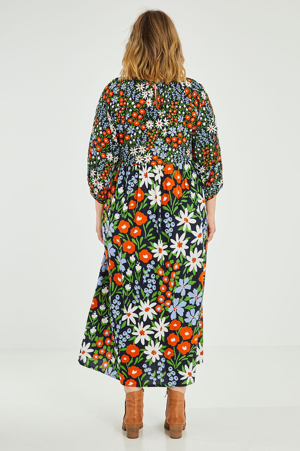 Model Jess wearing size 14 of the Alice Gathered Dress in colour Wildfield (Red), from the back