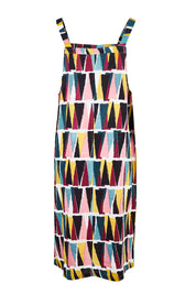Product shot of the Charlotte A Line Pinafore Dress in colour Mountains (Blue), from the back