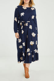 Model Jess wearing size 14 of the Lilly Long Sleeve Midi Dress in colour Camellia (Blue), from the front, cropped image