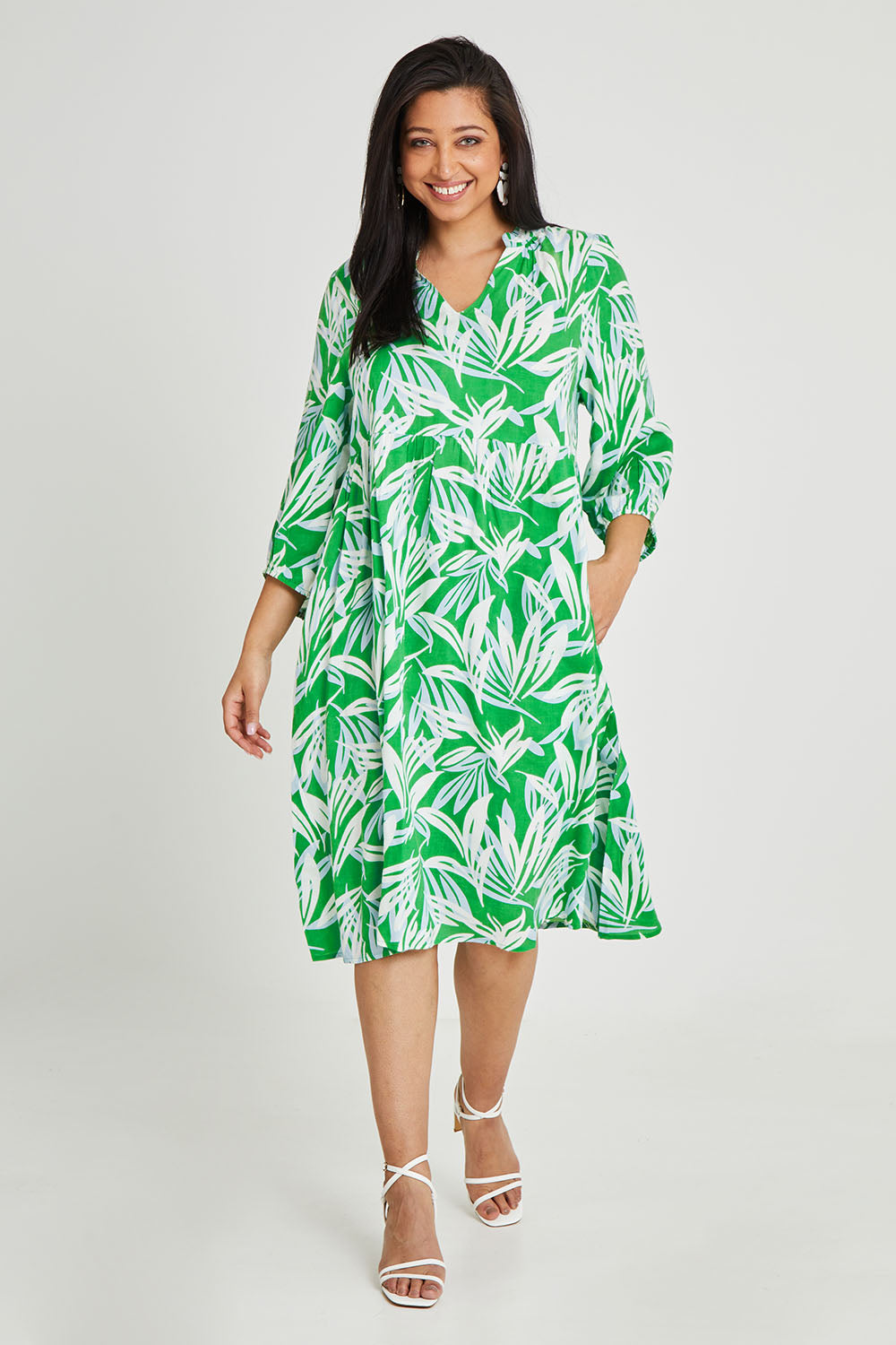 Model Terri-Leigh wearing size 14 of the Chloe Dress in colour Foliage (Green), from the front, showing the whole outfit