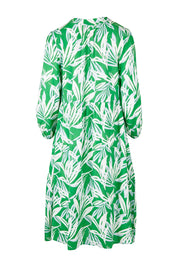 Product shot of the Chloe Dress in colour Foliage (Green), from the back